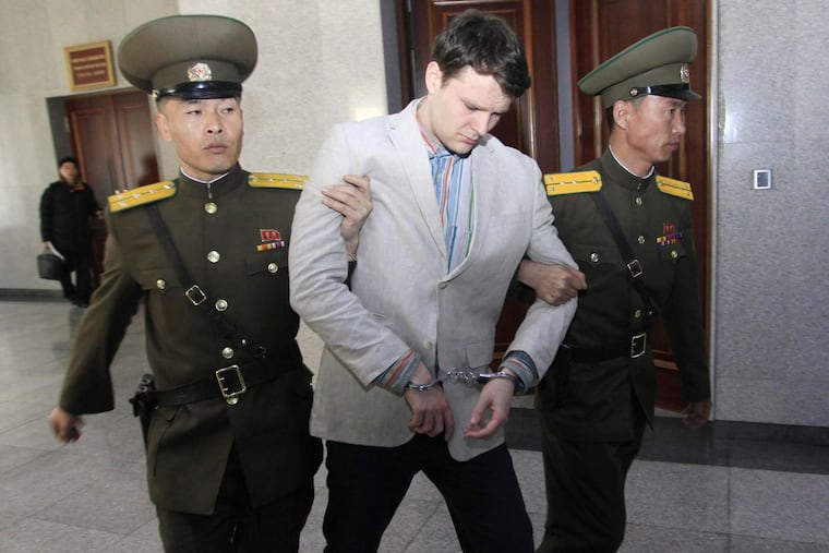 American student Otto Warmbier is escorted at the Supreme Court Wednesday, March 16, 2016, in Pyongyang, North Korea.