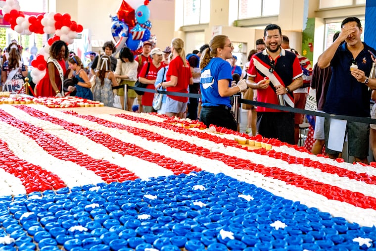 The Independence Visitor Center offers free birthday cake to the public Saturday, July 4, 2026, from a massive America flag made of 5,000 cupcakes frosted red, white and blue, as Philadelphia celebrates America’s 250th birthday.