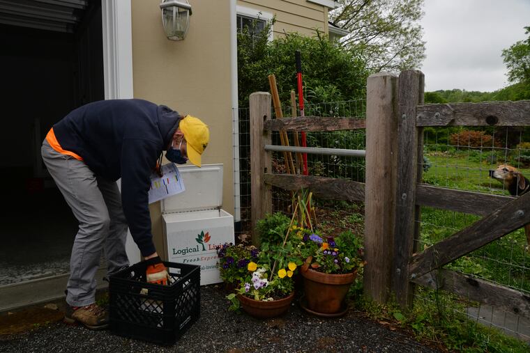 Charles Streitweiser, a milkman with Logical Living, drops off milk and other food items to customers in the West Chester area.