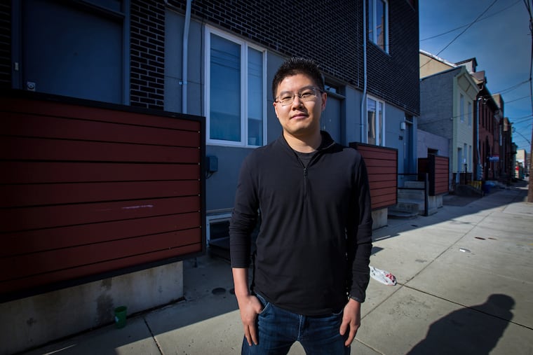 Ruokai Chen, shown here in front of his Kensington home last year, won an appeal of his land value last year by arguing to a judge that his land was assessed higher than his neighbors'. The land value of his home, which has a 10-year tax abatement for new construction, increased again this year.