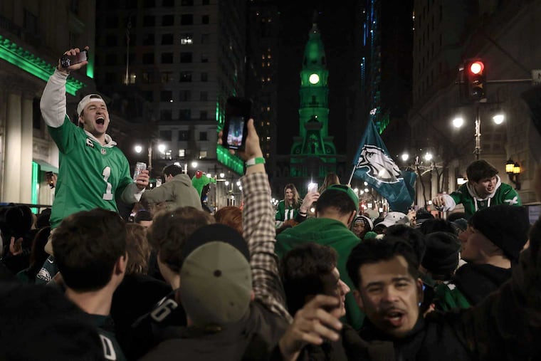 Fans celebrate the Eagles’ Super Bowl LIX win near City Hall.