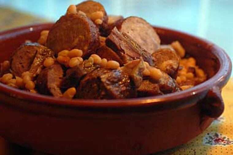 Cassoulet is one of the best things to eat, the terra cotta crock brimming with hearty white beans rich with duck confit and garlic sausage. (Ron Tarver / Staff Photographer)