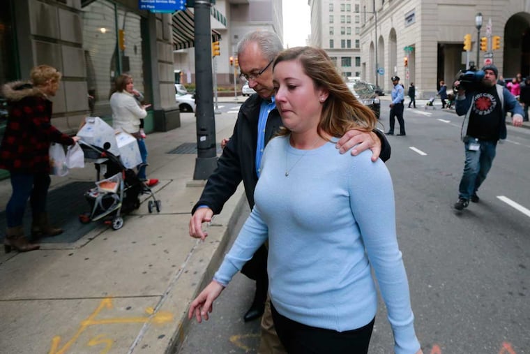 Kathryn Knott leaves the Criminal Justice Center with her father Karl Knott, police chief of Chalfont, Bucks County, on Friday, Dec. 18, 2015.