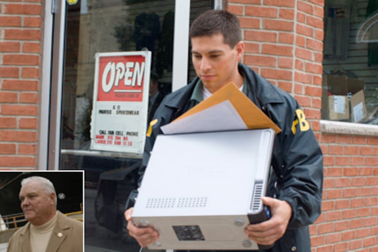A federal agent removes a computer from KO Printed Sportswear, located at 2001 Moyamensing, this morning. Agents also raided the office of State Rep. William Keller (inset). (Ed Hille / Staff Photographer)