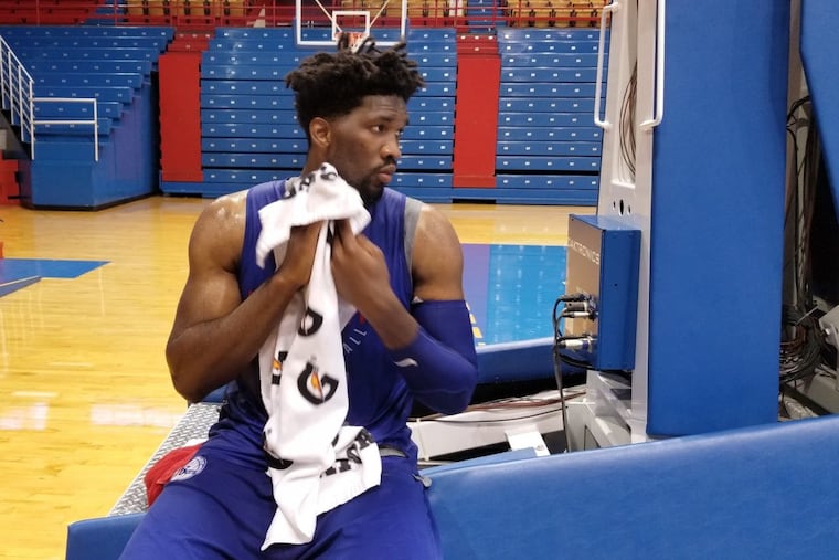 Sixers center Joel Embiid takes a break from shooting drills following Thursday’s practice at Allen Fieldhouse.
