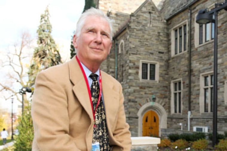 Michael Burns outside St. Joe's University's Barbelin Hall where he has taught and studied in one way or another for the past 50 years. Burns is part of a group of adjunct faculty members have gotten together to fight for better working conditions. ( RYAN S. GREENBERG / Staff Photographer )