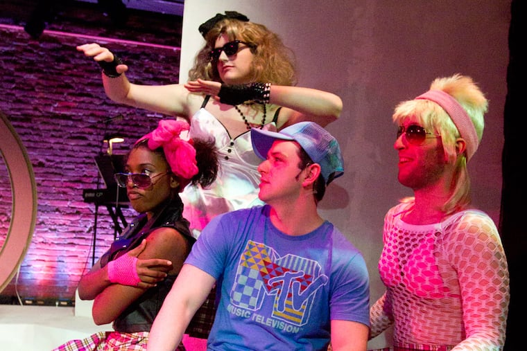 Michael O'Brien (center) 11th Hour Theatre Company's co-founder, says sporting goods companies have donated 1980s-style field hockey uniforms and equipment for the period musical. (Charles Fox / Staff Photographer)