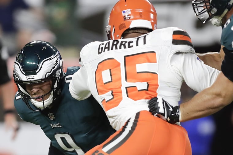 Eagles quarterback Nick Foles commits a first-quarter safety against Browns defensive end Myles Garrett during the team's preseason loss to the Browns.