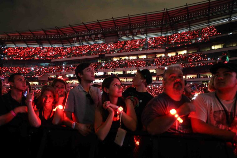 Fan's wristbands light up during a concert at Lincoln Financial Field in this August 2016 file photo. Eight of the top 10 concerts coming to Philly this year are outdoor shows.