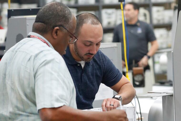 Employees at the Broward County Supervisor of Elections office count ballots during a recount, Wednesday, Nov. 14, 2018, in Lauderhill, Fla. (AP Photo/Wilfredo Lee)