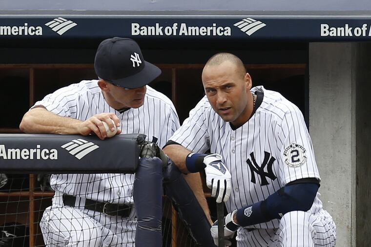 Phillies manager Joe Girardi, left, was both a teammate and manager of Derek Jeter's with the New York Yankees.