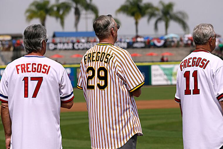 Pete Mackanin, Kent Tekulve and Bobby Knopp wear jerseys of Jim Fregosi. (Charlie Neibergall/AP)