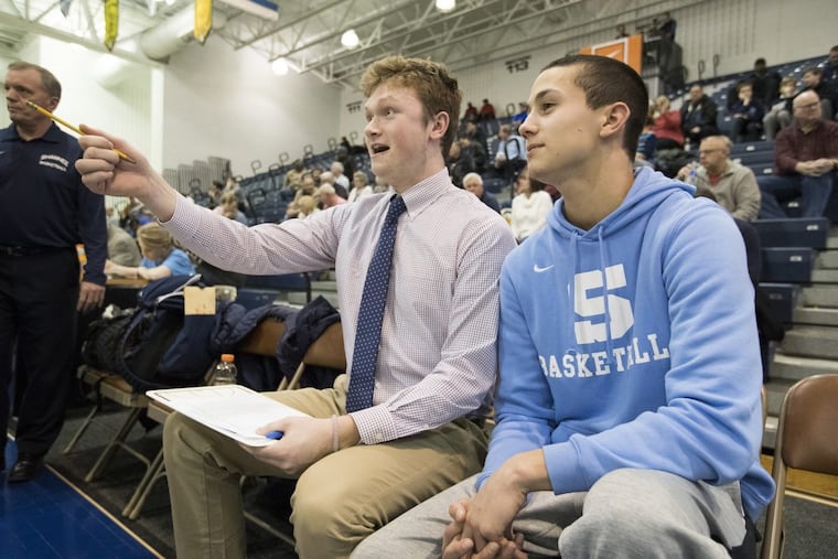 Injured Shawnee players Sean Heine (left) and Pat Kernan before the game against Woodbury in the NJSIAA Tournament of Champions quarterfinal at Toms River North.