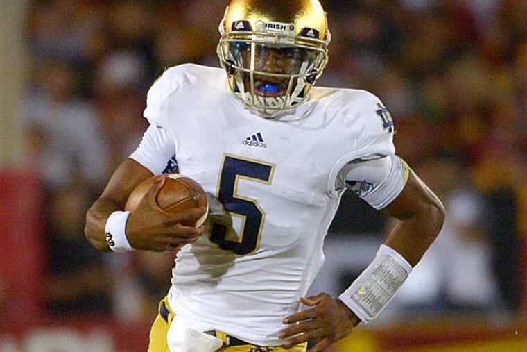 Notre Dame quarterback Everett Golson runs the ball during the first half of their NCAA college football game against Southern California, Saturday, Nov. 24, 2012, in Los Angeles. (Mark J. Terrill/AP)