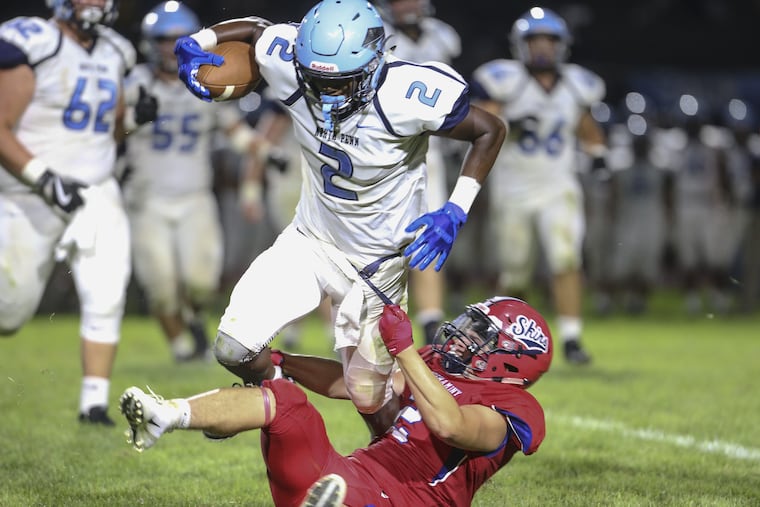 North Penn's Jon Haynes (2) is stopped by Neshaminy's Dawson Obringer (2) in the Knights' 34-33 victory on Aug. 24.