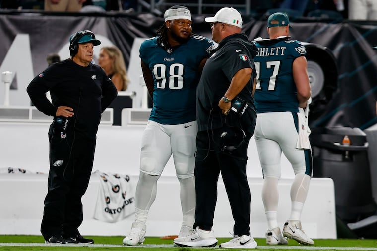 Eagles defensive tackle Jalen Carter leaves the field after being disqualified for unsportsmanlike conduct on the first play of the game.