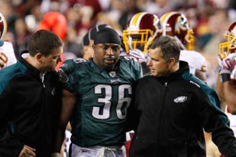 Brian Westbrook was escorted off the field after suffering a concussion during the first quarter against the Redskins. (Ron Cortes / Staff Photographer )
