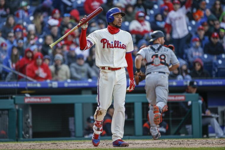 Phillies shortstop J.P. Crawford throws his bat down after striking out against the Marlins on Sunday. Crawford is struggling with his swing mechanics.