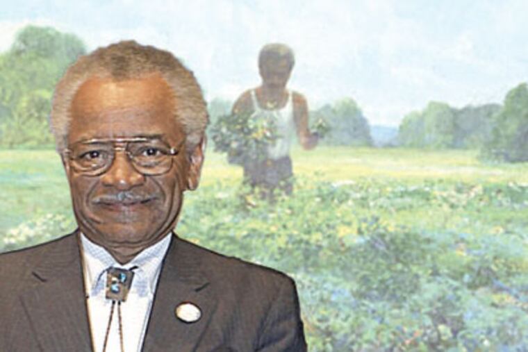 Philadelphia landscape artist Louis B. Sloan in front of one of his creations.