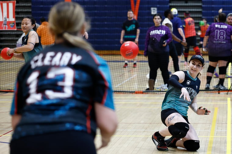 Elizabeth Lawson-Keister (right) of team Empire, a WTNB (women, trans, and nonbinary) dodgeball team, throws a dodgeball while taking on team Sirens during the "Beast Coast" championship Saturday at Ben Franklin High School.