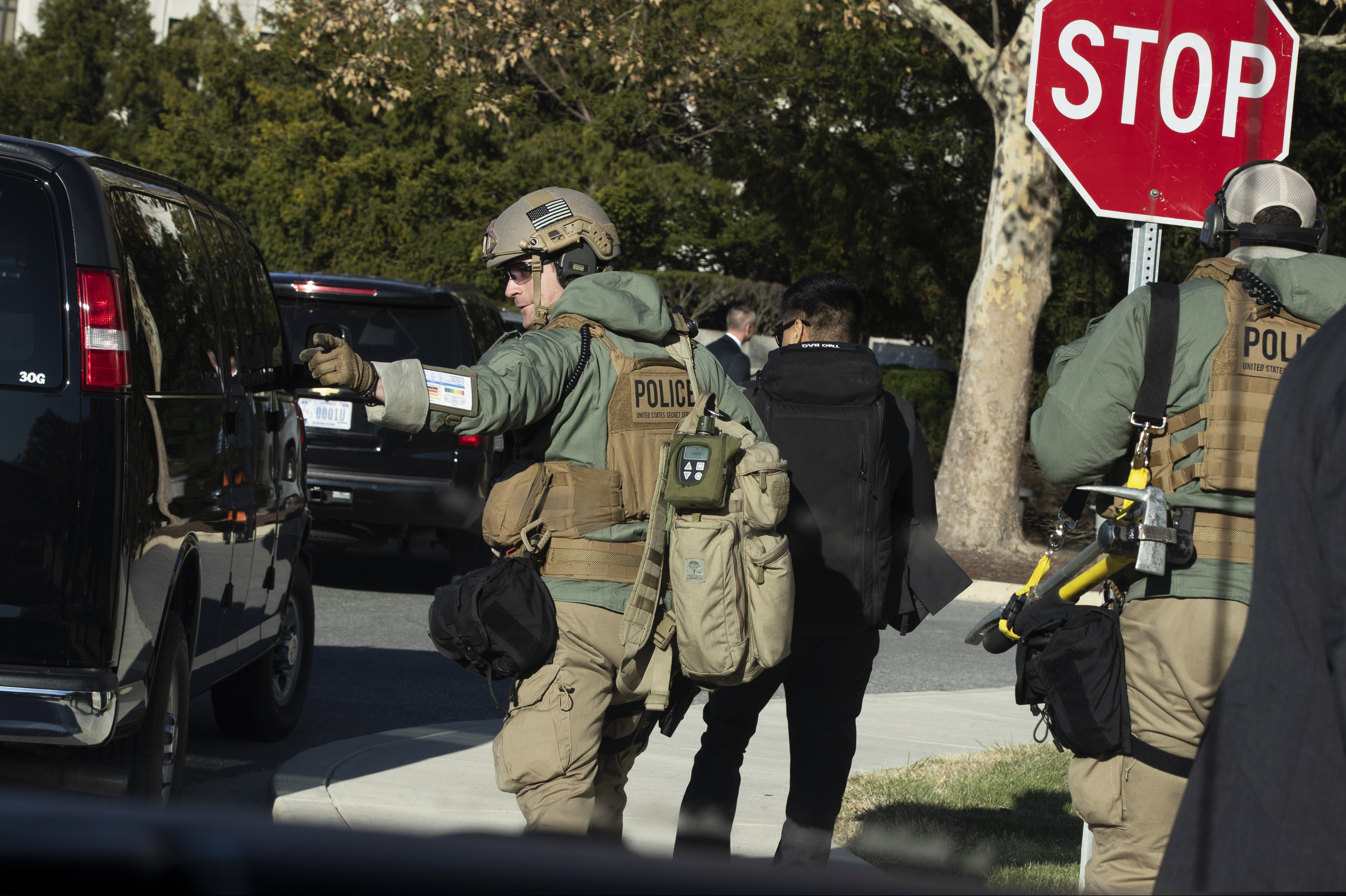 Members of the U.S. Secret Service' Hazardous Agent Mitigation and Medical Emergency Response (HAMMER) Team, move from their vehicle as President Donald Trump is visiting Walter Reed National Military Medical Center, Saturday, Nov. 16, 2019, in Bethesda, Md.