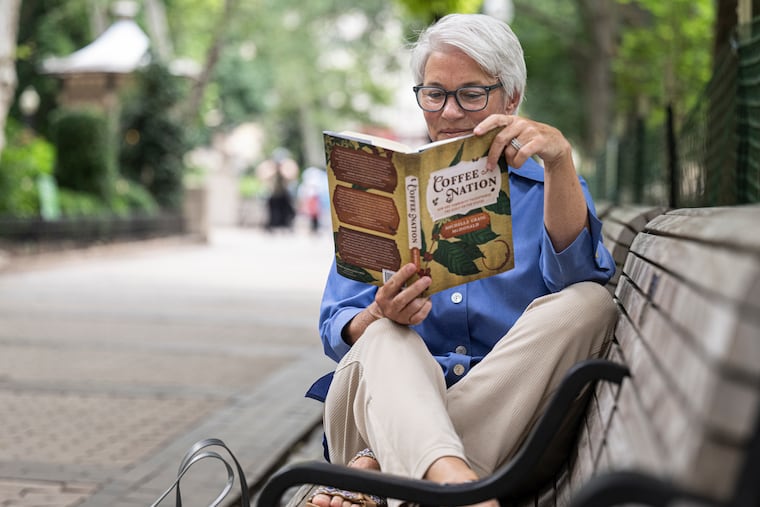 Philly historian and educator Michelle Craig McDonald enjoys reading in Rittenhouse Square Park. She is the author of "Coffee Nation: How One Commodity Transformed the Early United States.”