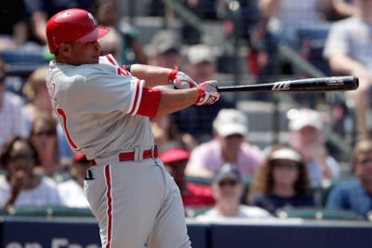 Phillies catcher Carlos Ruiz hit his first career grand slam on Saturday against the Braves. (David Goldman/AP Photo)