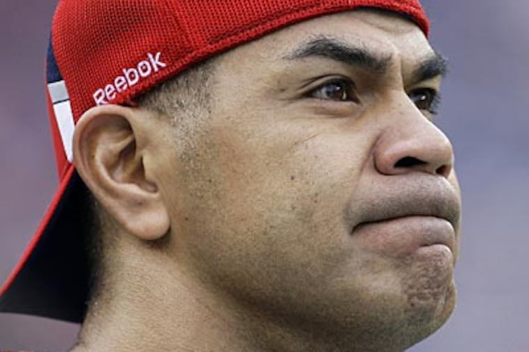 Police say Junior Seau, a former NFL star, was found dead at his home in Oceanside, Calif., Wednesday. (Charles Krupa/AP file photo)