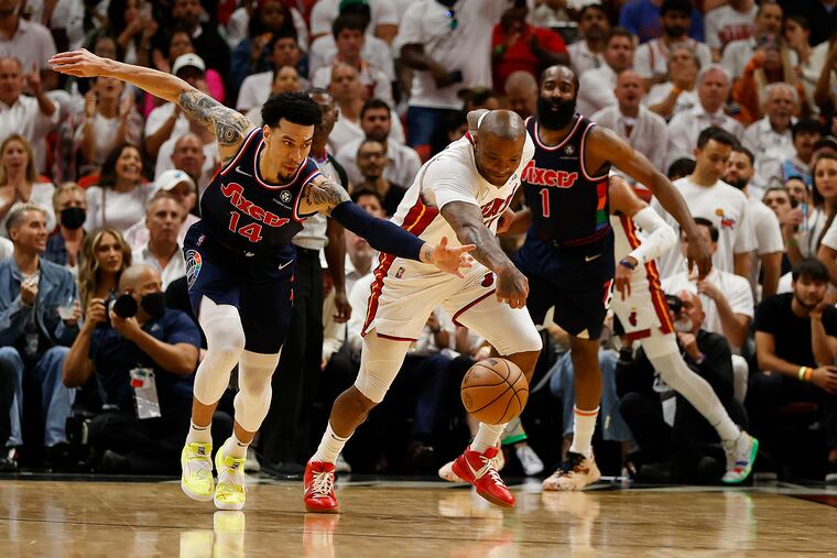 Sixers forward Danny Green goes after the basketball against Miami Heat forward P.J. Tucker during the third quarter in game five of the second-round Eastern Conference playoffs on Tuesday, May 10, 2022 in Miami.