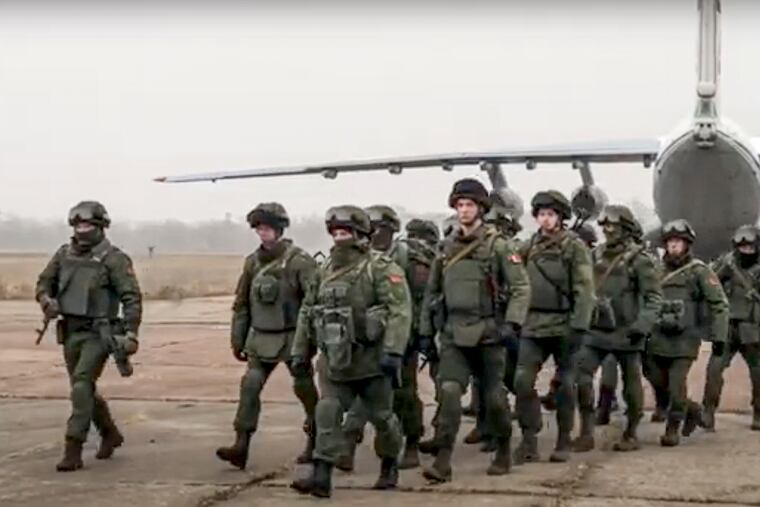 In this handout photo released by Russian Defense Ministry Press Service, Belarusian peacekeepers leave a Russian military plane at an airfield in Kazakhstan, Saturday, Jan. 8, 2022. As Kazakhstan struggles to cope with an increasingly violent uprising this week, it has turned for help to a Russian-led security bloc, the Collective Security Treaty Organization. Thousands of Russian troops have now been dispatched to Kazakhstan to help secure strategic facilities.