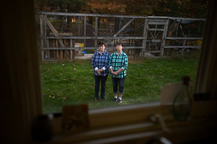 Twins Lori Leonard (left) and Debra Leonard at Lori’s home in Scotia, Pa.
