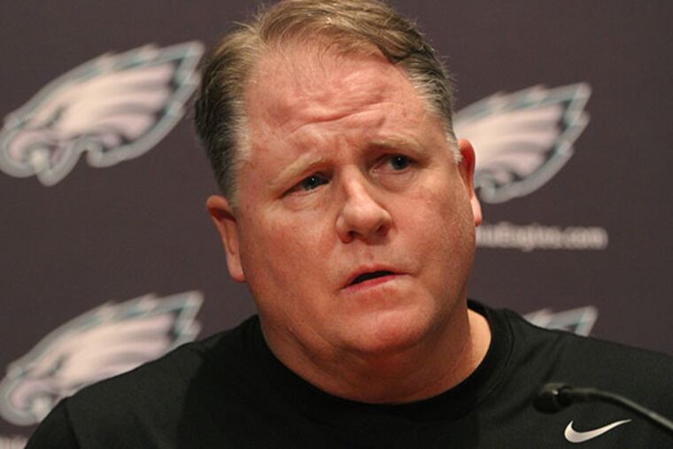 Eagle head coach Chip Kelly listens to a question about the moves he
and the team made over the past few days. (Michael Bryant/Staff Photographer)