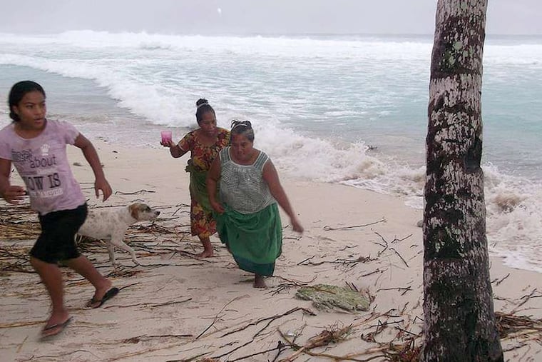 On the island of Kiribati, top right, residents move away