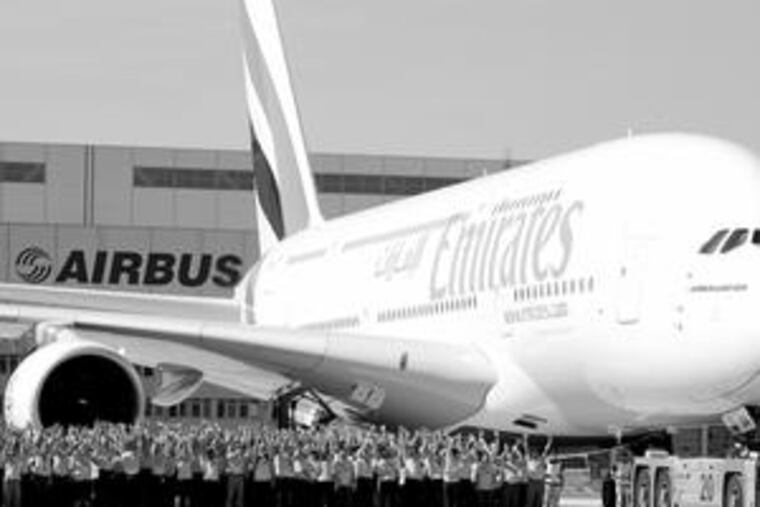 The first Airbus A380 landed at New York's JFK airport on Friday. The plane belongs to Emirates Airlines, which is owned by the U.A.E.