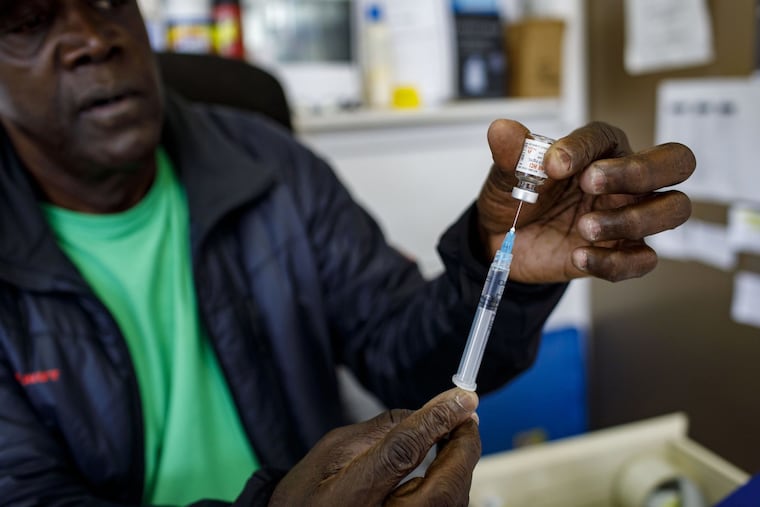 Health educator Robert Banks demonstrates how to prepare a dose of naloxone on Oct. 21, 2019, from his desk at University of Illinois at Chicago clinic in the Austin neighborhood. Banks, who runs the needle exchange at the clinic, said he has given the emergency treatment many times while waiting for paramedics to arrive after a drug overdose. Banks believes opening a safe consumption site would be a safer option.