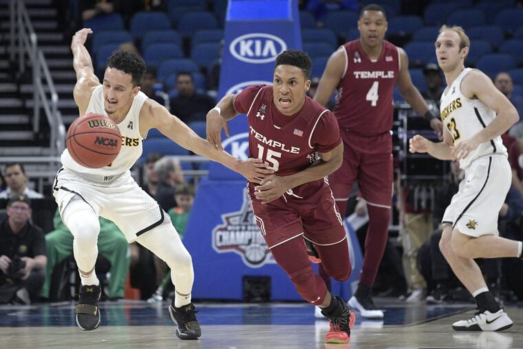 Temple guard Nate Pierre-Louis (center) steals the ball from Wichita State guard Landry Shamet (left), left, during the Owls’ loss to the Shockers on Friday.