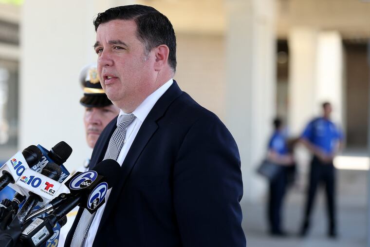Lt. John Walker of Southwest Detectives holds a news conference at the Philadelphia International Airport after an employee allegedly stabbed and killed a co-worker in a break room.