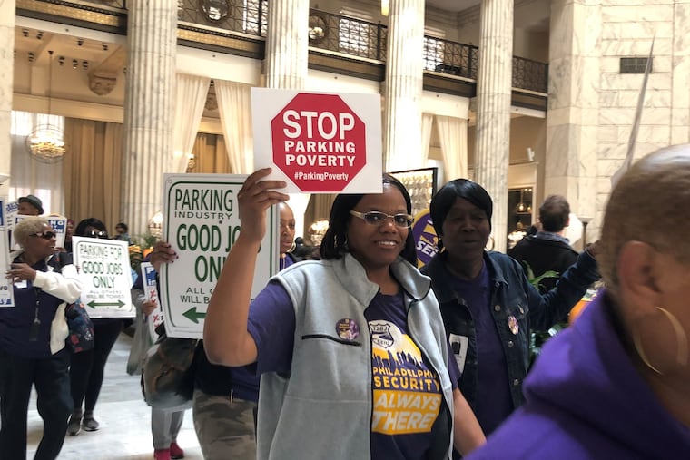 Parking workers and 32BJ SEIU members rallied at the Ritz Carlton after the City Council hearing on two bills to regulate the parking industry.