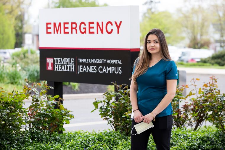 Louise Rogenski, a DACA recipient and Scan Technician at Temple University Hospital, is pictured outside of the emergency room. Rogenski has been working at the hospital since January and has been responsible for scanning the lungs of patients with COVID-19. She could face deportation if the Supreme Court ends the DACA program.