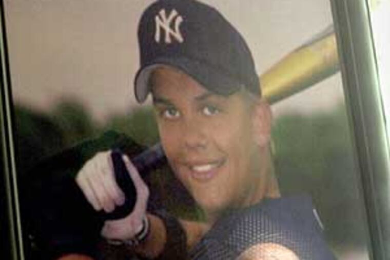 Don Hooton is reflected in a portrait of his son Taylor, who turned to steroids after a coach told him he needed to get bigger. The elder Hooton has taken his battle against the drugs to the Internet and the halls of Congress.