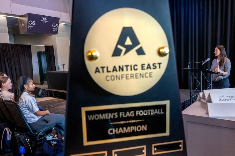 Julie Hirshey (right), Eagles vice president of community relations, speaks as the Atlantic East becomes the first conference to recognize women’s flag football as an NCAA sport.