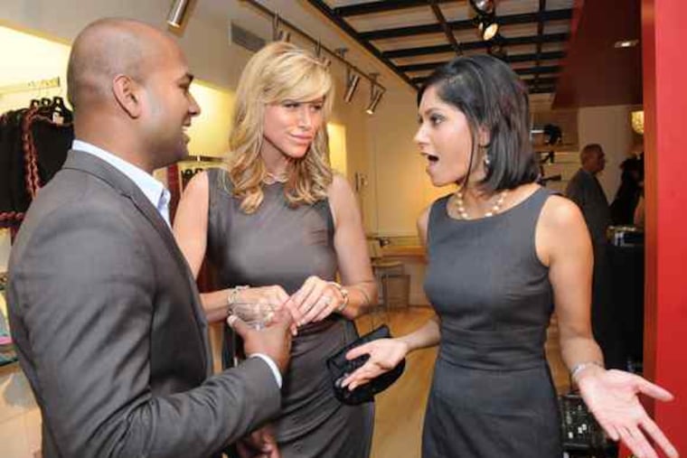 Television networking: NBC10's Mac Francis with CBS3's Lesley Van Arsdall (center) and NBC10's Aditi Roy at Thursday's launch party forthe new men's and women's stores at Boyds Philadelphia in Center City.