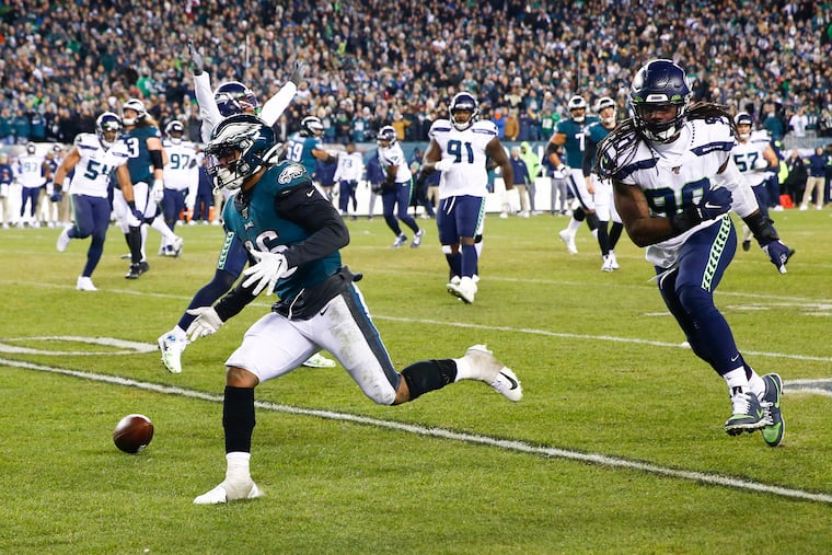 Eagles running back Miles Sanders couldn't hang onto a key pass from Josh McCown in the fourth quarter.