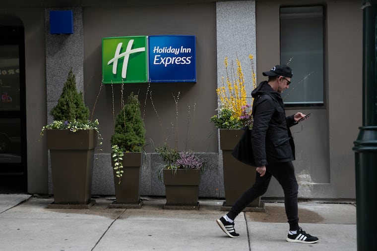 The Holiday Inn Express at 13th and Walnut in Center City is photographed on Tuesday, March 24, 2020. The city is planning to turn the hotel into Philadelphia’s first coronavirus quarantine site, and use it to house homeless people who test positive for the virus, according to two people with knowledge of the plans.