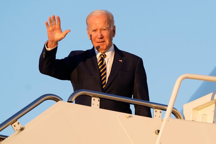 President Joe Biden waves as he boards Air Force One on Monday at Andrews Air Force Base, Md.