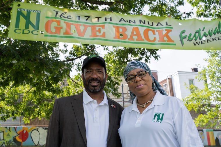 Zakariyya and Taheerah Abdur-Rahman pose for a portrait at Nicetown Park before the start of the 17th annual "Give Back" Community Festival Weekend in honor of their two sons Zakee and Zafir, both killed by gun violence.