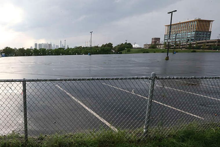 From parking lot to practice facility on Camden's Waterfront. The Sixers are required to maintain 250 jobs here to keep the tax credit. (Steven M. Falk/Staff)