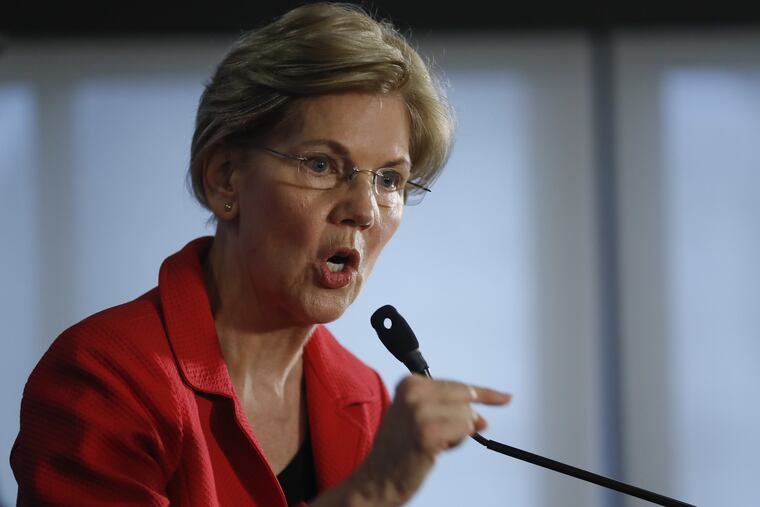 Sen. Elizabeth Warren, D-Mass., gestures while speaking at the National Press Club in Washington, Tuesday, Aug. 21, 2018.