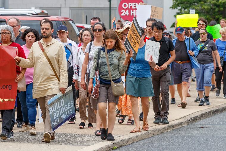 On Monday, June 24, 2019, a line of protesters circle the block of ICE Headquarters, on 8th Street, to protest the Trump administration's plans for mass deportations of illegal immigrants.