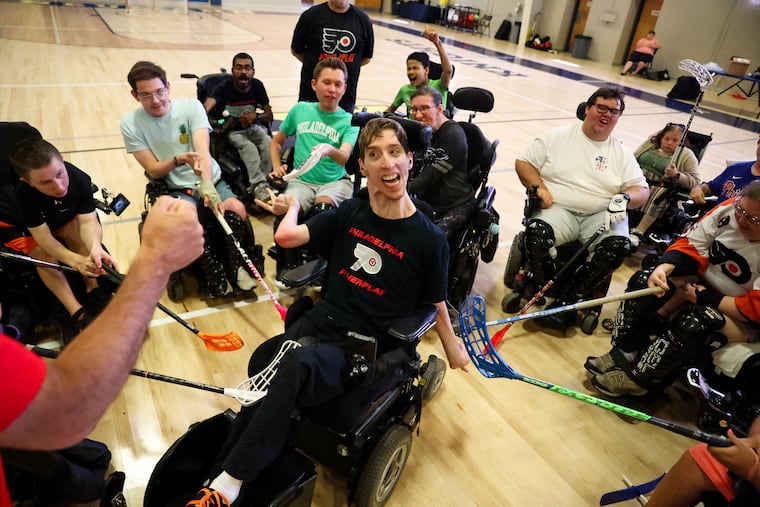 The Flyers PowerPlay team huddles around Sean Hesser at the end of practice on Saturday at Neumann University. PowerPlay's two teams will compete in the Powerhockey Cup, which starts Friday at Neumann.